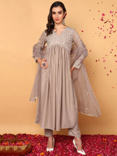 Women Nude Silk Blend Solid Embroidered Flared Kurta Trouser With Dupatta